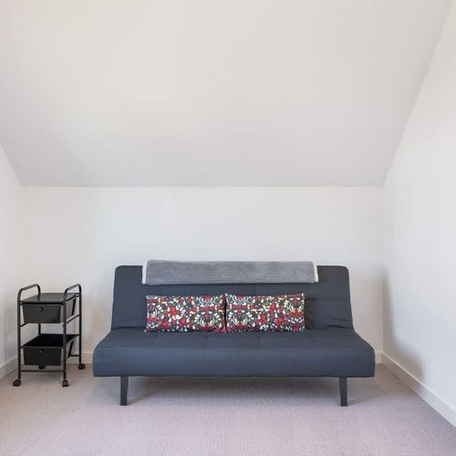 The second bedroom includes a desk, desk chair and futon suitable for 1 person.