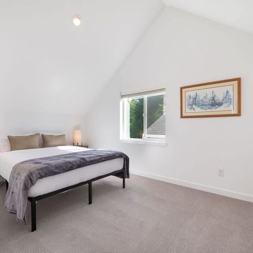 The main bedroom features a queen sized bed.