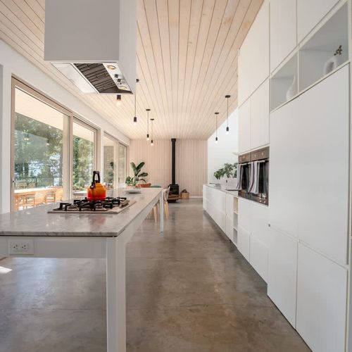 Walking in to the full kitchen and open concept living space.