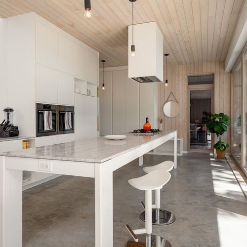 Walking in to the full kitchen and open concept living space.