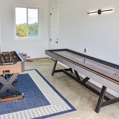 Large game room with space to play and hang out—ideal for groups or rainy days.