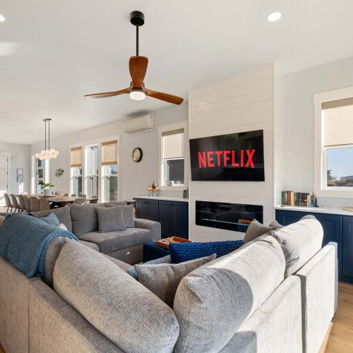 Watch a movie or light the fire—spacious main floor layout with seating for all.