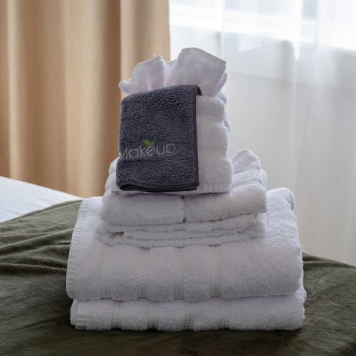Every bed is made with care—plush towels and linens ready for your stay.