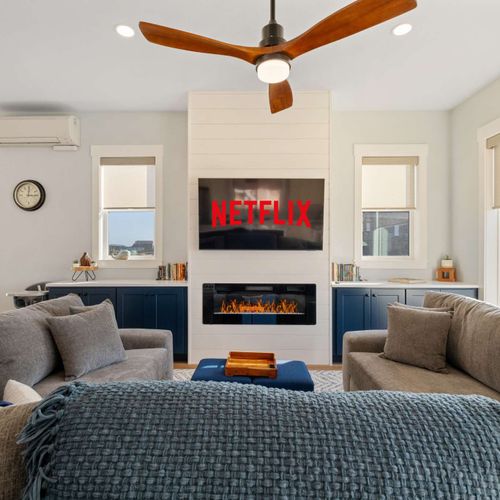 Unwind on plush sofas, stream your favorite shows, and enjoy the warmth of the electric fireplace after a day at the beach.