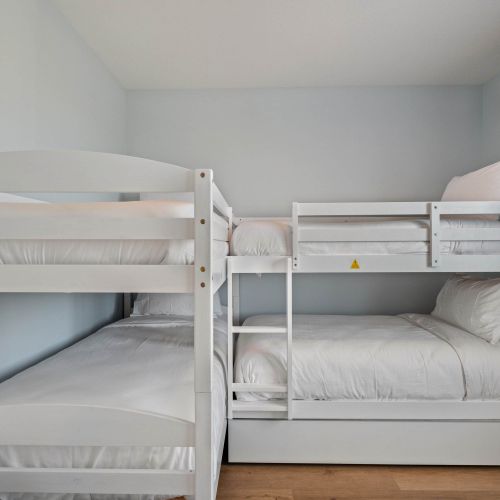 Perfect for kids or groups—sleeps five with pullout trundle bed below.
