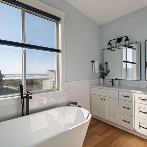 Relax in the tub or rinse off in the large shower—windows bring in the view.