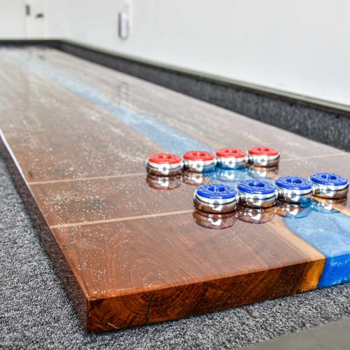 Challenge friends to a game—shuffleboard and foosball ready for use.