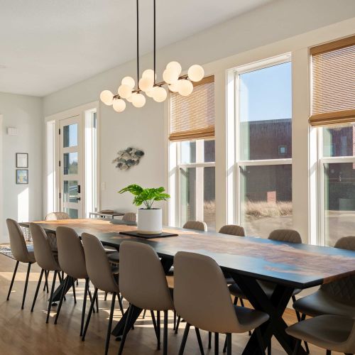 Large dining area with ocean light and space for the whole group.