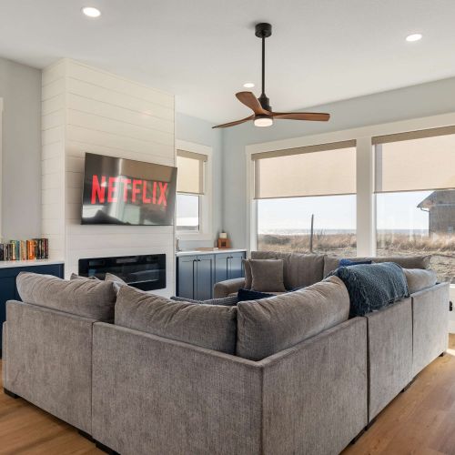 Big windows bring in light and views from every angle—comfortable for everyone to gather.