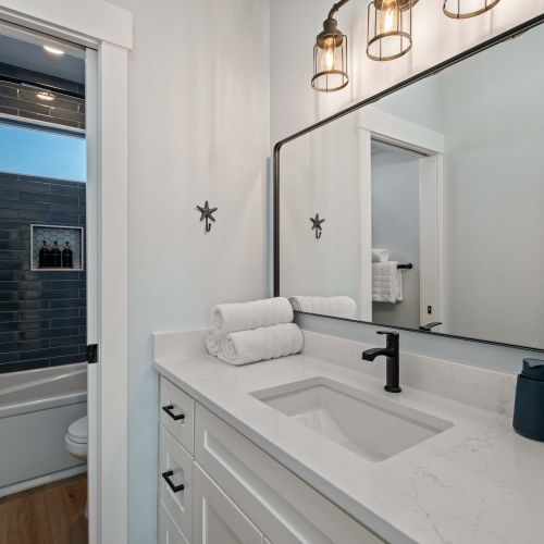 Bathroom 3 of 3 - Bright finishes and storage space.