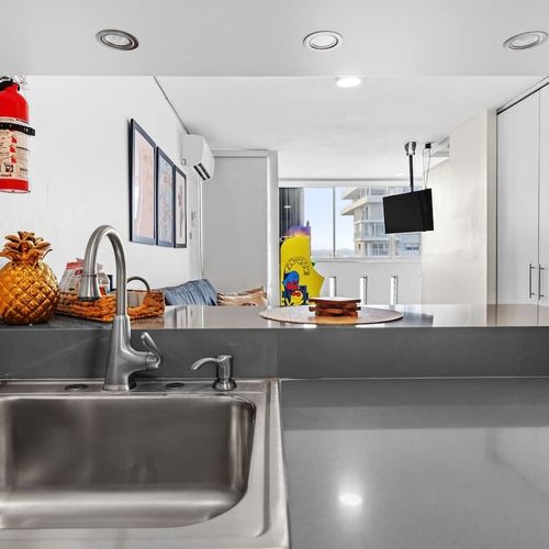 Contemporary kitchen with stainless steel amenities.