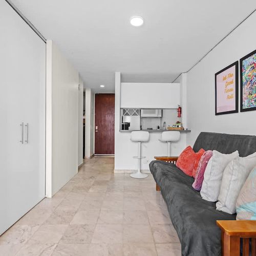 Cozy living area connected to the modern kitchen.