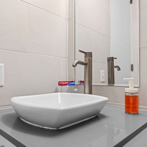 Stylish sink with a sleek, modern faucet.