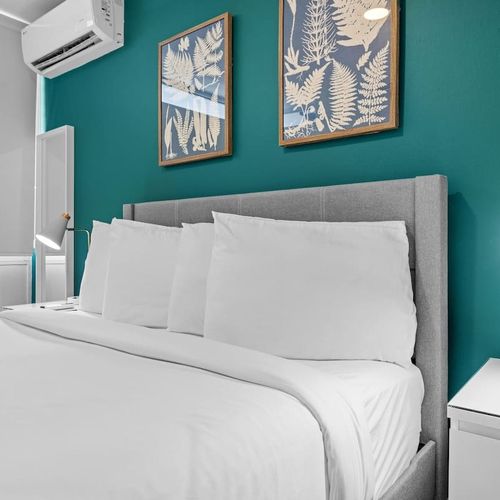 "Modern and cozy bedroom, perfect for a peaceful night.