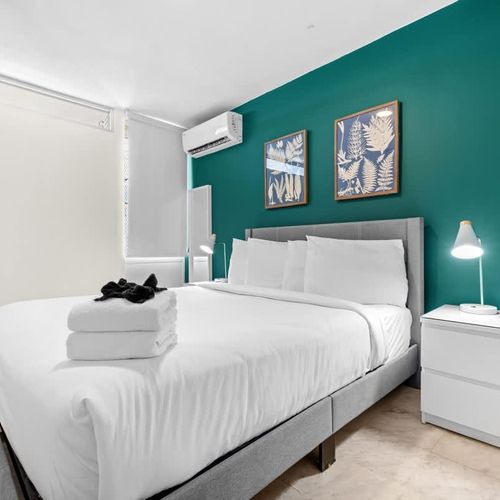 Designer bedroom with striking wall art.