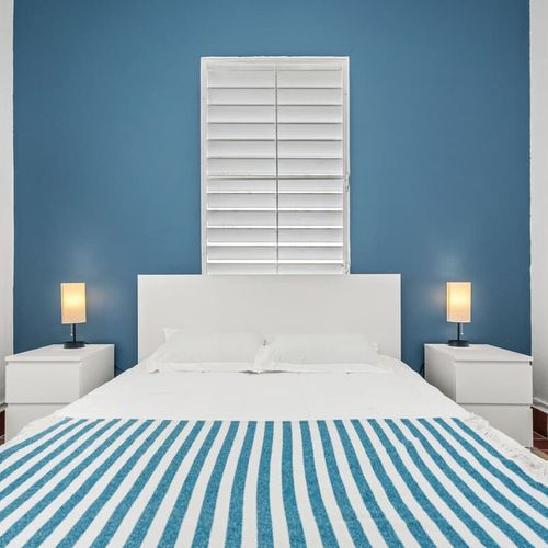 Step into a world of comfort and simplicity; our bedroom is your sanctuary for rest amidst the bustling city life.