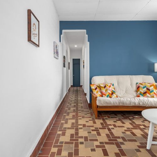 Discover a haven of tranquility within the city; relax on the plush sofa amidst an ambiance of contemporary elegance.