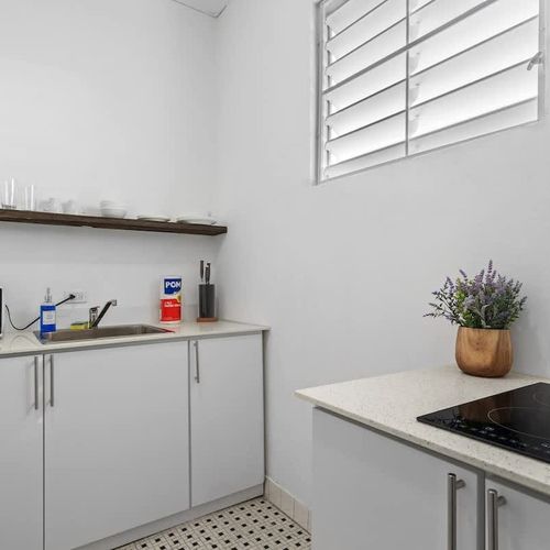 Warm wooden accents complement the modern appliances in this cozy preparation area.