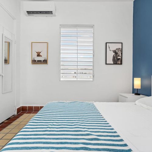 Indulge in the cozy ambiance of our stylish bedroom; every detail is designed for your ultimate comfort and relaxation.