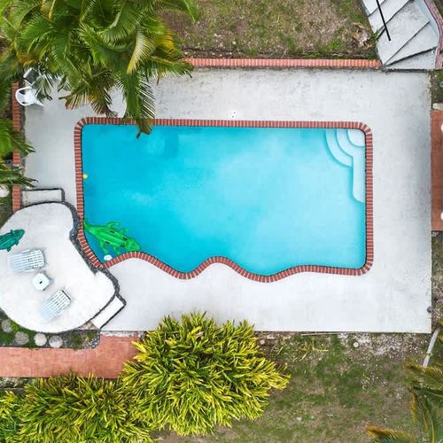 house outdoor views showcasing a huge pool for the whoel family