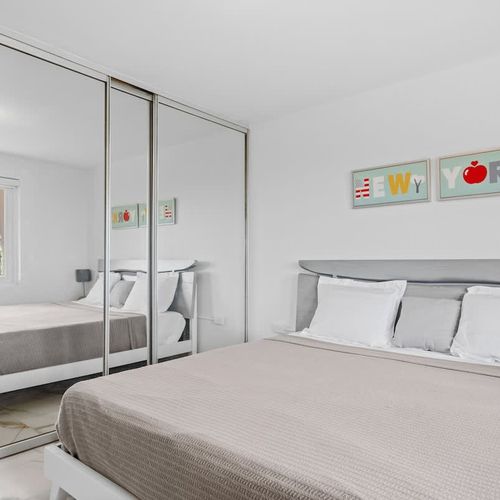 A tranquil bedroom with a minimalist aesthetic.