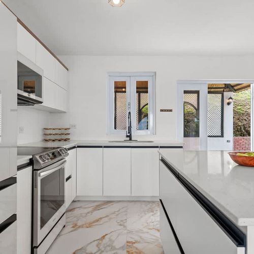A bright and airy kitchen with ample counter space.