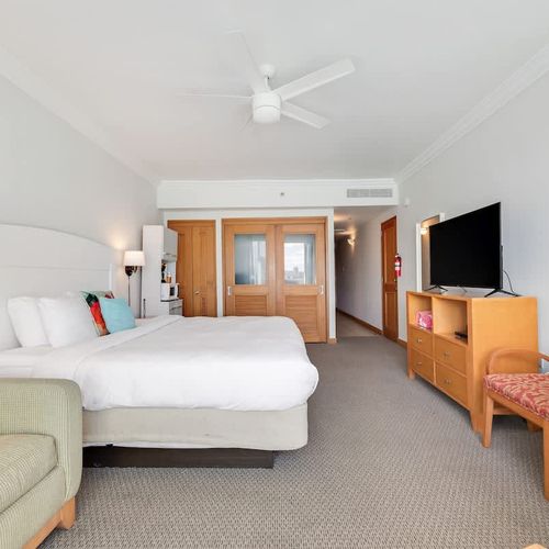 Relax and unwind in a beautifully appointed space with a comfortable king-size bed and a large flat-screen TV for your entertainment.