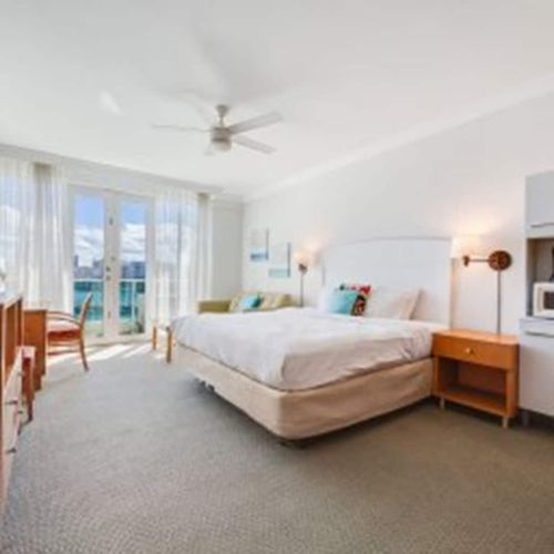 Wake up to stunning water views! This bright, spacious studio features direct balcony access, perfect for enjoying your morning coffee with a beautiful backdrop.