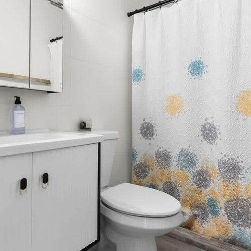 Sleek and modern bathroom with contemporary fixtures and spacious shower. Designed for your comfort.