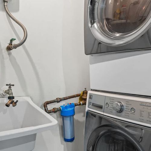 Experience the convenience of a dedicated in-unit laundry area with a full-sized washer and dryer. Keep your clothes fresh and clean throughout your stay, just like home.