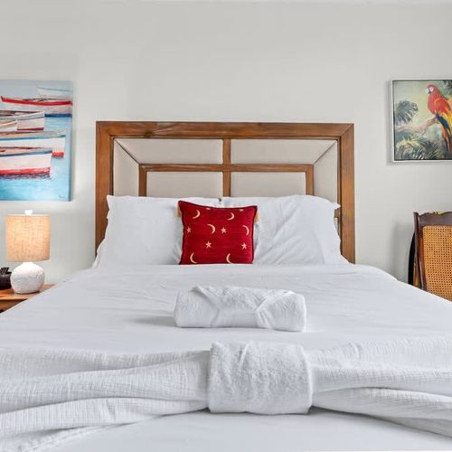 Indulge in our elegant master suite with a luxurious queen-sized bed. An opulent haven for ultimate relaxation.