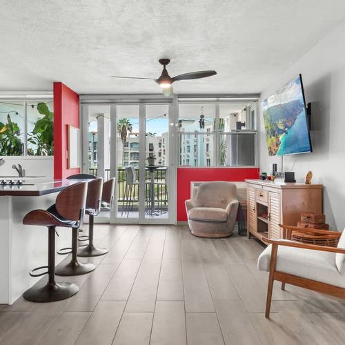 Chic open-concept living and dining area for comfort and entertaining. Enjoy stylish relaxation and meals.