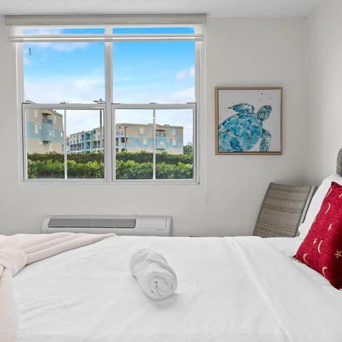 Comfortable bedroom offering peaceful views of the beautiful exterior. Ensures a restful and inspiring stay.