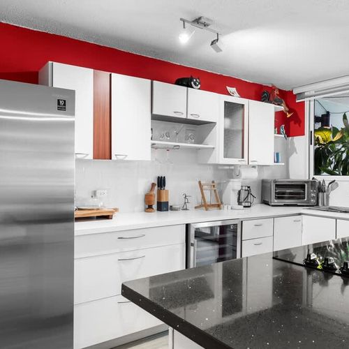 Convenient kitchenette with essential appliances. Perfect for preparing snacks and light meals.