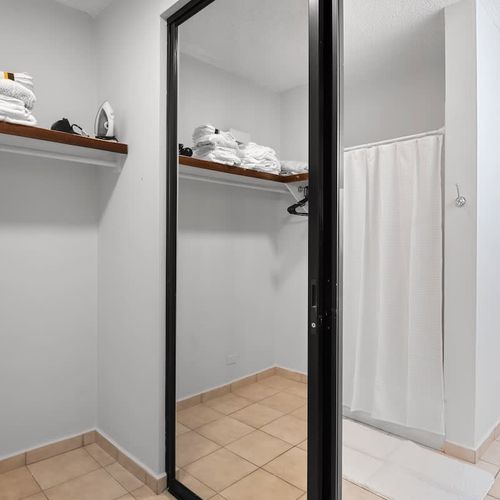 Ample closet space with built-in shelving to keep your belongings organized.