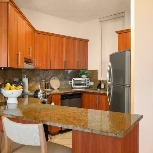 Fully equipped kitchen for preparing delicious meals with ease.