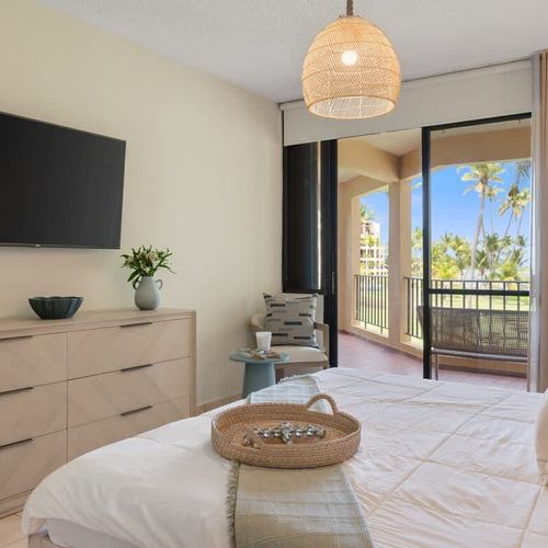 Inviting bedroom offers a stylish and tranquil tropical vibe.