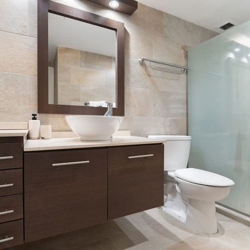 Enjoy the convenience of a sleek shower and elegant vanity.