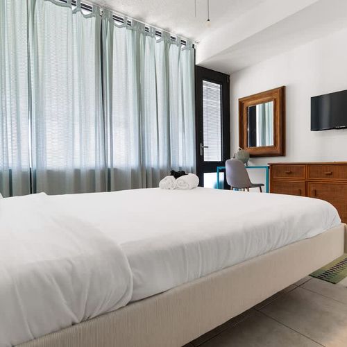 A tastefully decorated bedroom, ensuring a comfortable and rejuvenating stay.