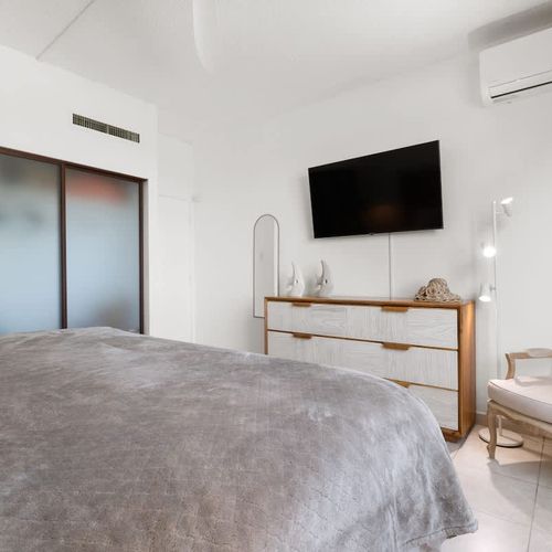 A serene bedroom with a minimalist design, ensuring a tranquil night's sleep.
