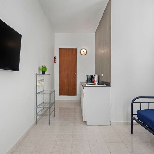 Indulge in your favorite shows on the sleek flat-screen TV.