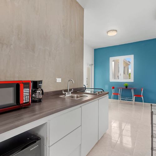 Prepare your favorite meals in this sleek, fully equipped modern kitchen.