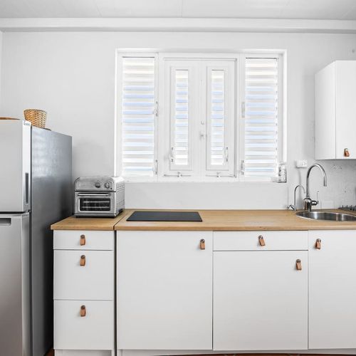 A well-equipped kitchen for light cooking.