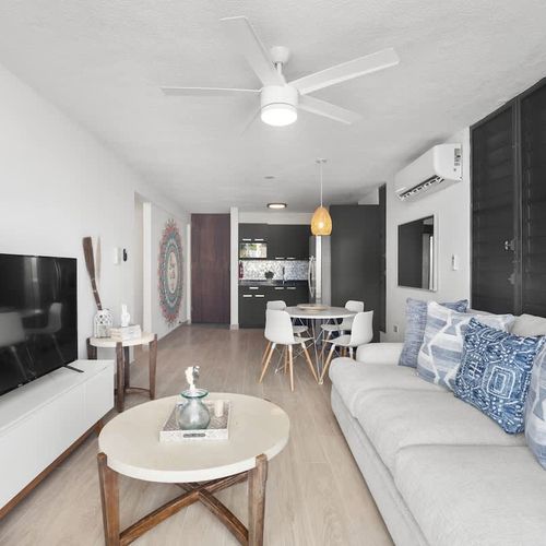 Relax and unwind with a movie on the plush sofa in our cozy living area.