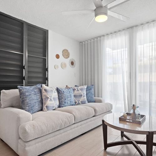 Our living room, designed for ultimate relaxation, features a plush sofa and soft throws.