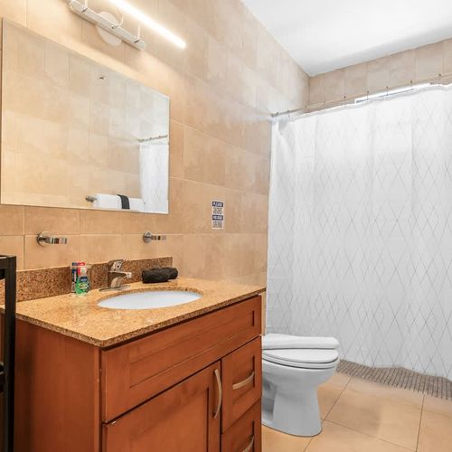 Sparkling Clean Modern Bathroom. Fresh Towels.