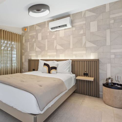 Experience tranquility in this beautifully designed bedroom that seamlessly blends functionality with style.