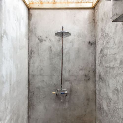 Modern chrome fixtures complement the minimalist design.