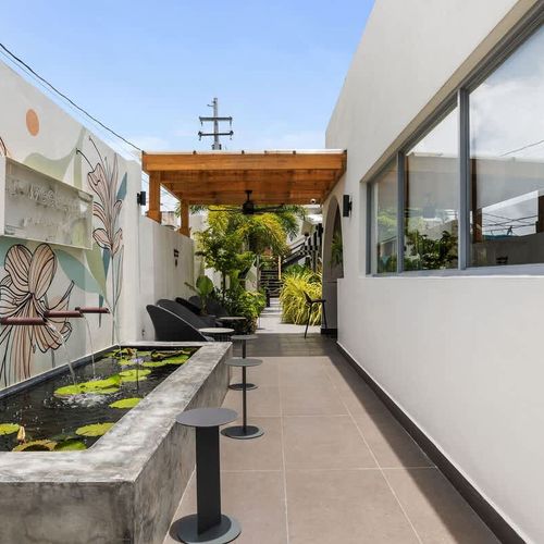 Discover a haven of tranquility where every detail is designed to delight. From the sun-drenched pool to the invigorating outdoor gym and whimsical signage, our exterior is an oasis of relaxation and fun.