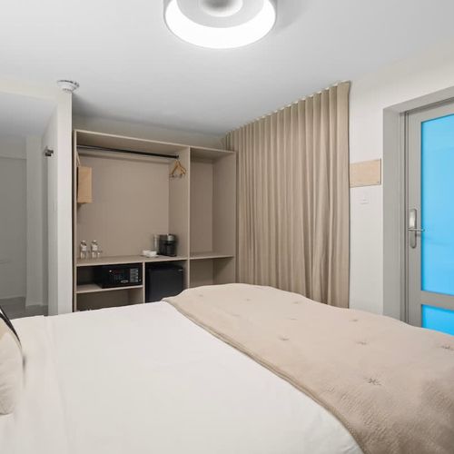 A modern bedroom with closet.